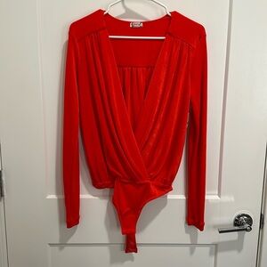 Bodysuit. Brand new. Size S. Never been worn, comes w/ tags. Color: Bella rose.